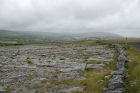 Karst pavements and topography of the Burren approx 5km south of Ballyvaughan Co Clare Ireland. Exposures of the Dinantian Burren Limestone Formation are composed of shallow water carbonates. Note the clints (limestone blocks) and grikes (joints formed by Variscan folding (Coller, 1984) and fracturing) enlarged by Pleistocene disolution (Williams, 1966).